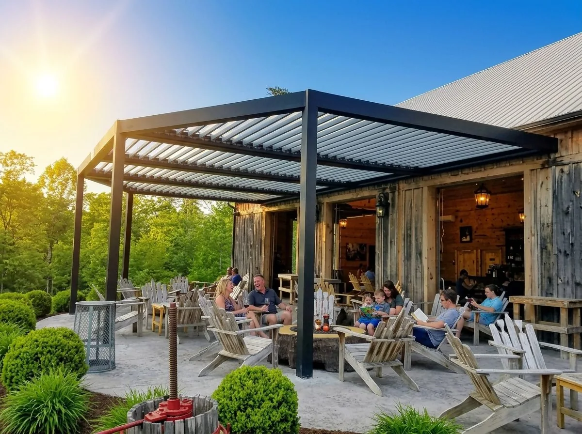 Custom black louvered pergola over a patio at sunset